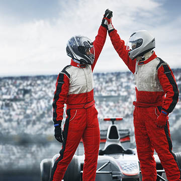 Two Formula 1 drivers high-fiving